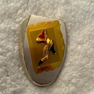 Elgin American shoe detail mirror case with signs of wear